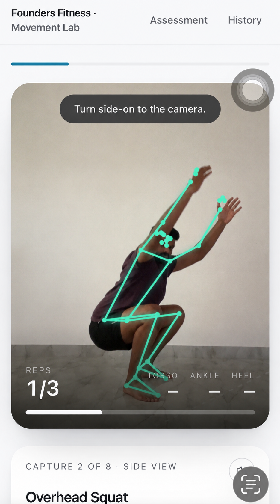 Side-view capture of an overhead squat with skeleton overlay and torso, ankle and heel readouts
